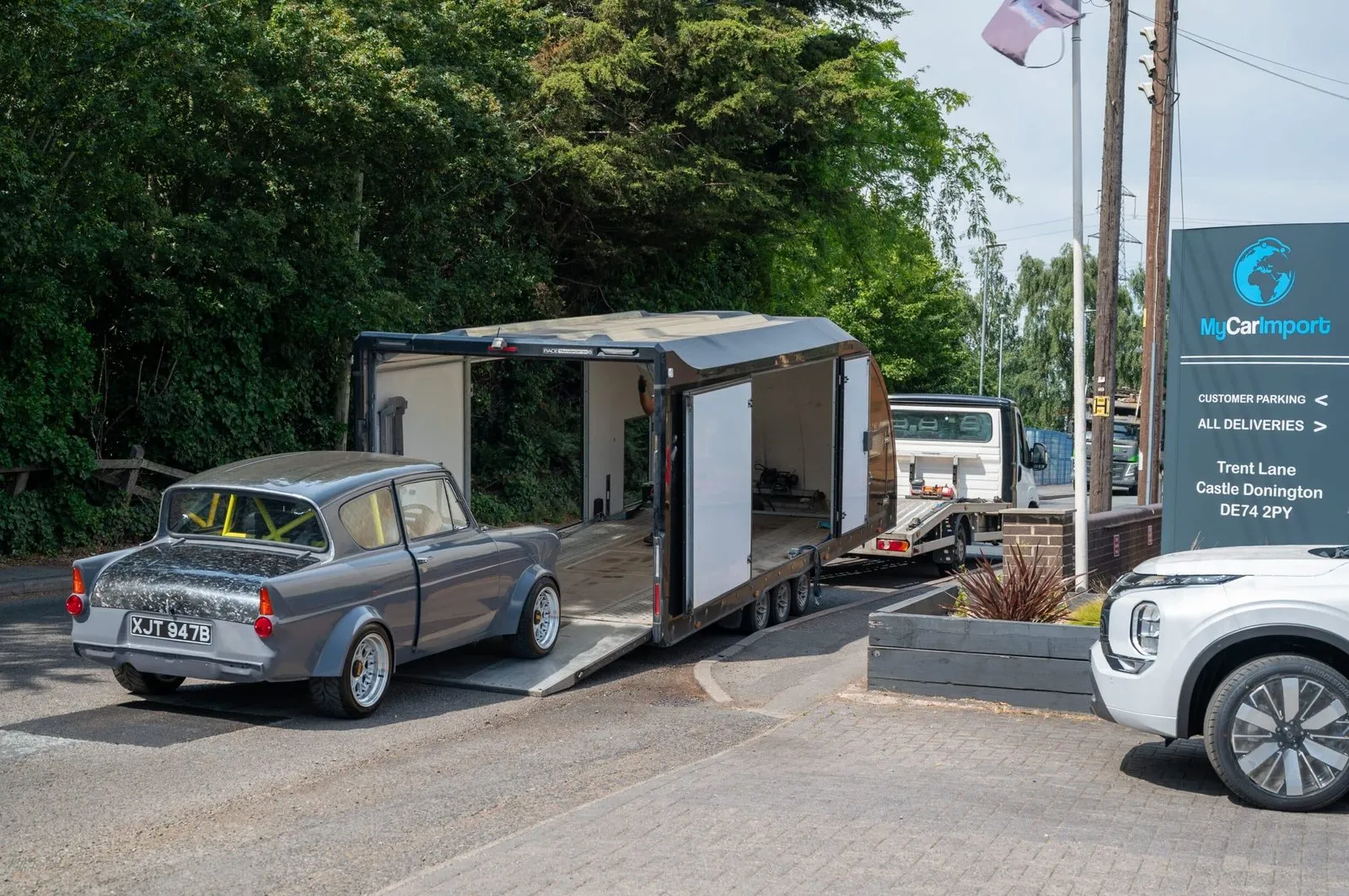 A classic Ford Anglia being unloaded at My Car Import