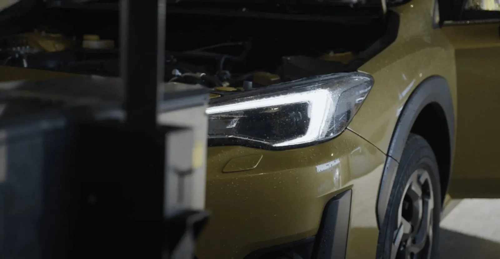 A headlight being checked in the My Car Import workshop