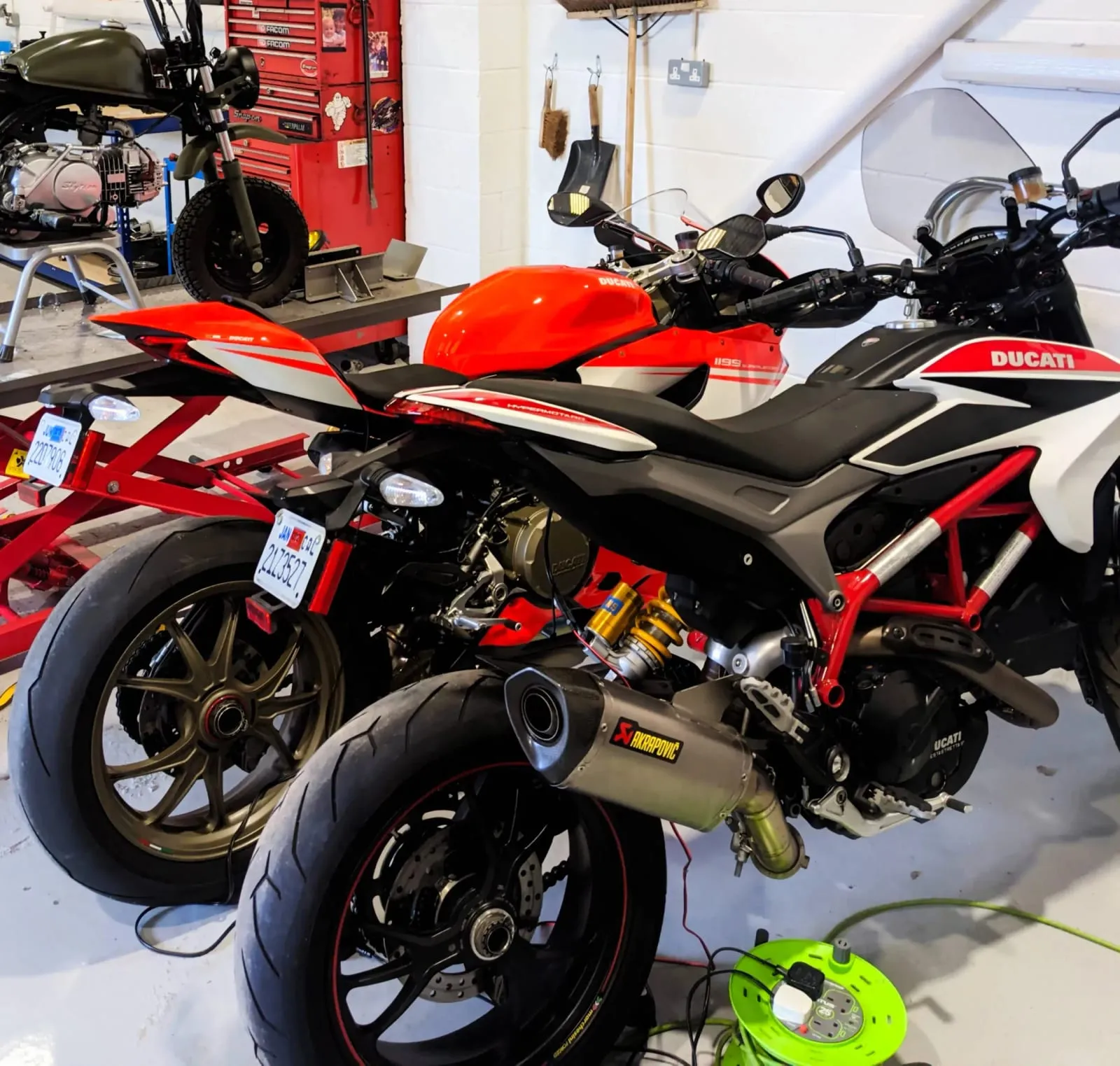 Two Ducati motorbikes in the My Car Import workshop