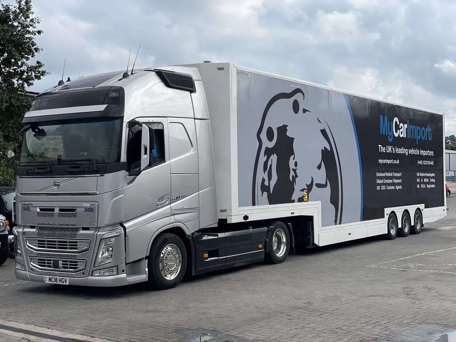 A My Car Import branded car transporter